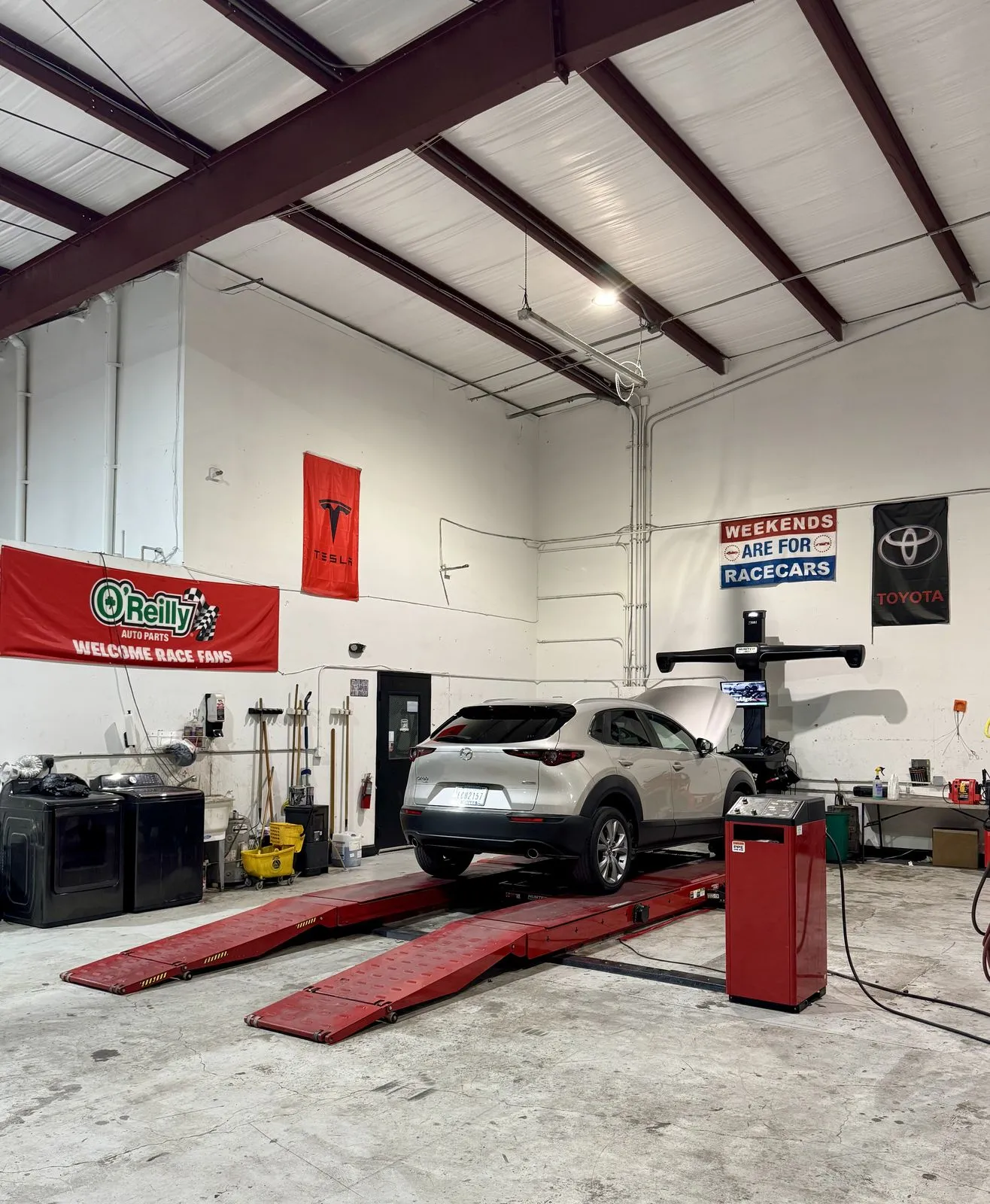Wide view of the alignment bay at 239 Mechanics with a vehicle on the alignment rack