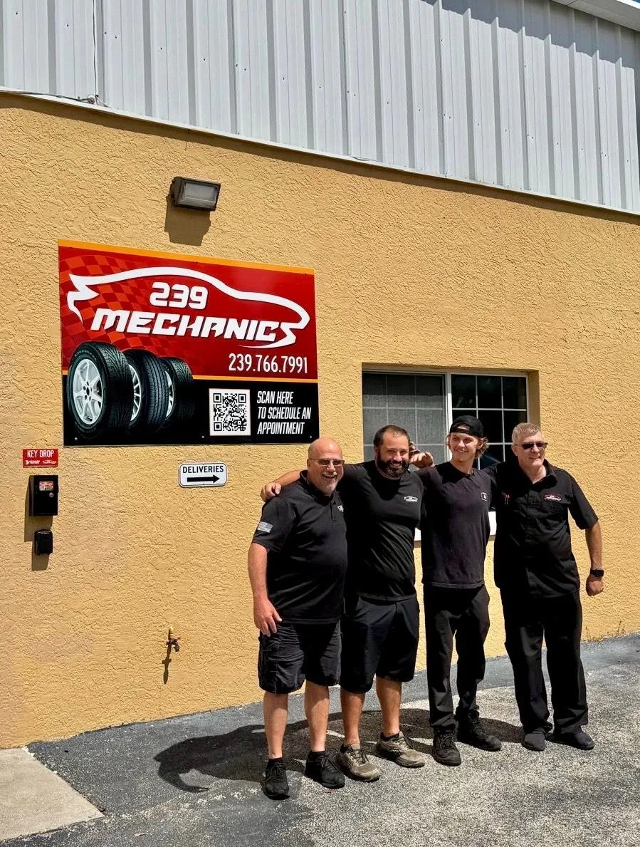 The 239 Mechanics team standing outside the shop beneath the 239 Mechanics sign in Cape Coral